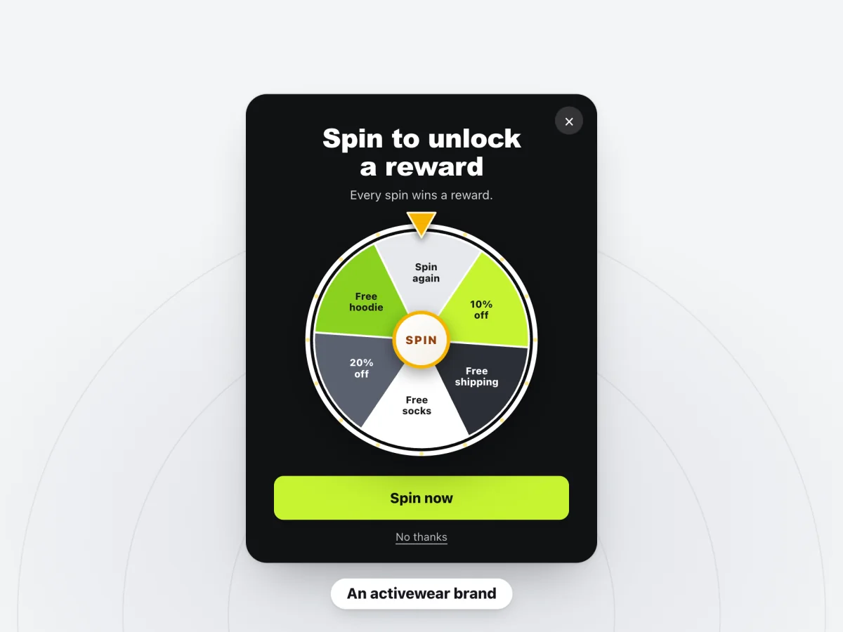 A spin-to-win pop-up for an activewear brand titled "Spin to unlock a reward"