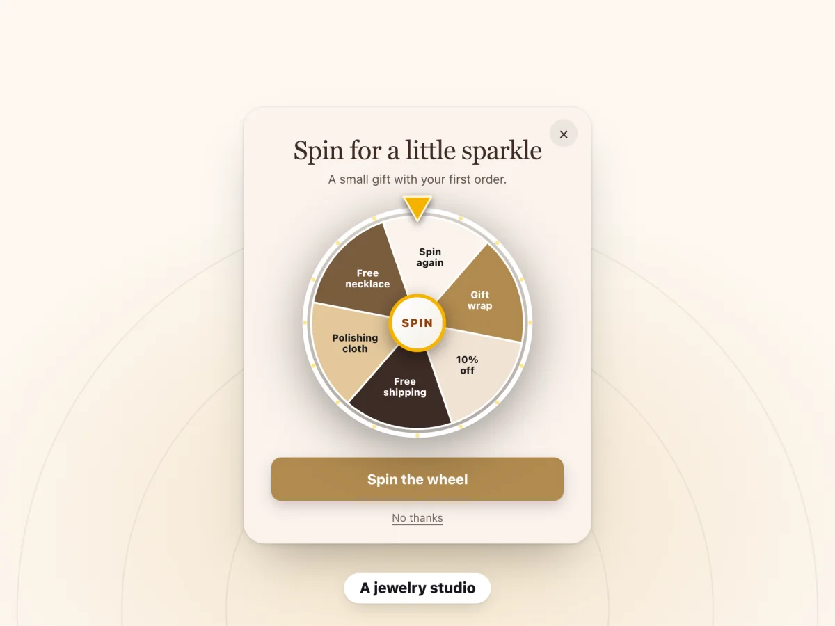 A spin-to-win pop-up for a jewelry studio titled "Spin for a little sparkle"